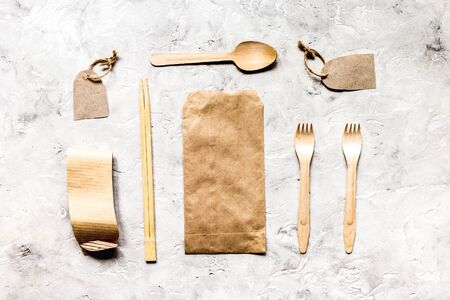 paper bags for food delivery on restourant stone table background top view mockupの写真素材