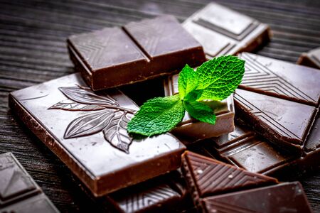chopped chocolate pieces with mint for dessert on wooden desk backgroundの写真素材