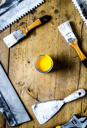 builder work with professional repairing implements set on wooden background top viewの写真素材