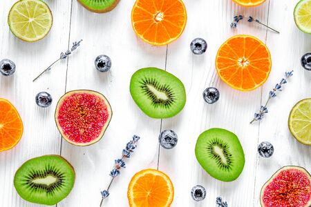 cut fruit design with blueberry and lavender on white background top view patternの写真素材