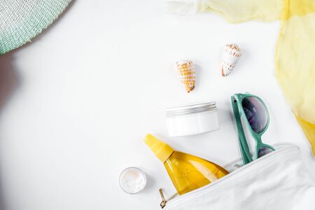 Sun protection concept with cream and lotion on white background top viewの写真素材