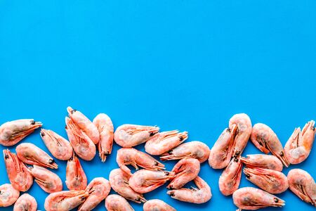 Prawn background on blue table top view.の写真素材