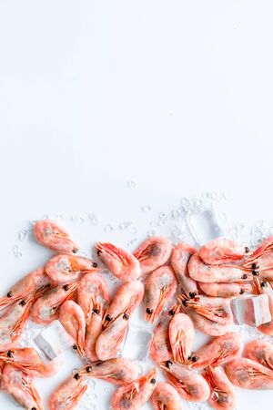 Shrimps - frozen, with ice, at shell - on white backgroud.の写真素材