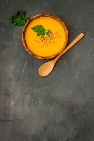 Pumpkin soup on grey background top view.の写真素材