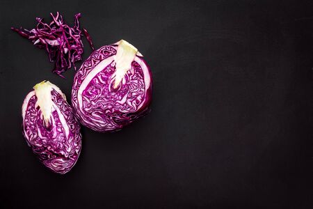 Red cabbage - cut head and sliced - on black desk from above copy spaceの写真素材