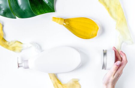 cream and lotion cosmetic for sun protection and hands in a woman hygiene concept on white background top viewの写真素材