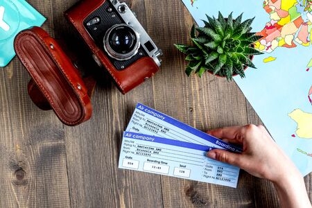 vacation concept with traveller outfit on wooden background top view space for textの写真素材
