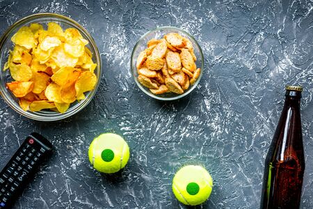 watching movies concept with chips on dark background top view mock upの写真素材