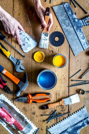 instruments set for decorating and building renovation on wooden background top viewの写真素材