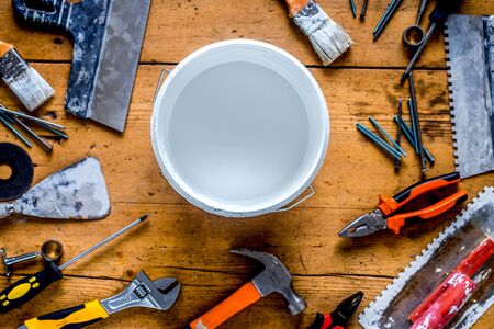 professional builder work with house renovation instruments on wooden background top viewの写真素材