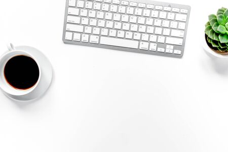 woman office desk with keyboard and cup of coffee white background top view space for text