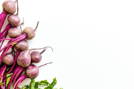 Organic beetroots with green tops and leaves on white background. Top viewの写真素材