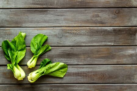 Bok choy on wooden table top view copy spaceの写真素材
