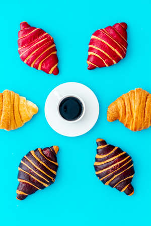 Set of coffee with croissants chocolate, berry, classic on blue stone tableの写真素材