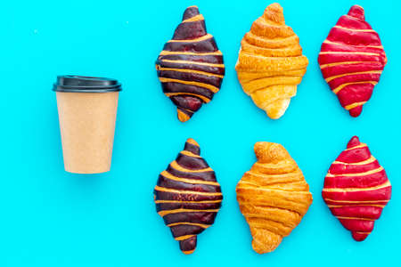 Set of coffee with croissants chocolate, berry, classic on blue stone table