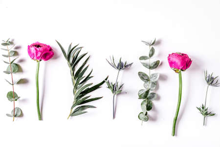 floral concept with pink flowers on white background top view mock-upの写真素材