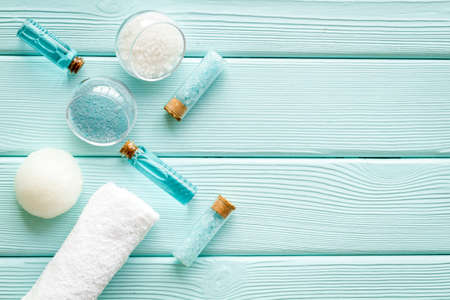 Spa treatments set with sea cosmetics - salt and aroma oil. Top view