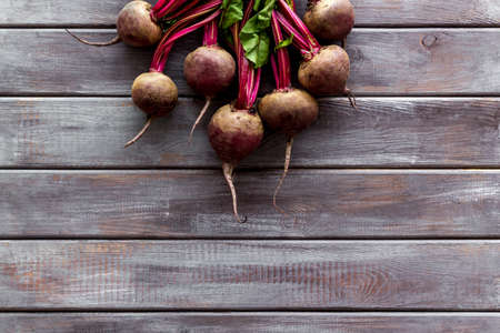 Beet - fresh, with leaves - on wooden table top view copy spaceの写真素材