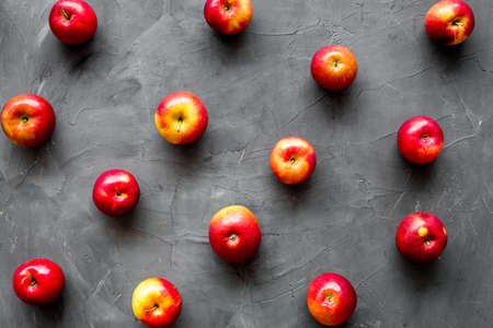 Fruit pattern of red apples on table desk top viewの写真素材