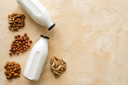 Bottles of non-dairy vegan milk - lactose free nuts and grain drink. Top viewの写真素材