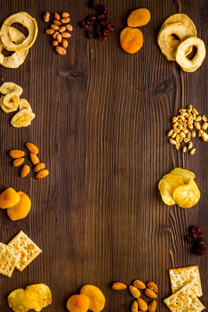 Frame of nuts overhead with dried fruits and other snacks top viewの写真素材