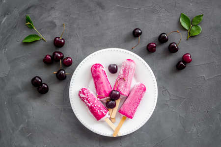 Cherry ice cream, berry on the table, top view
