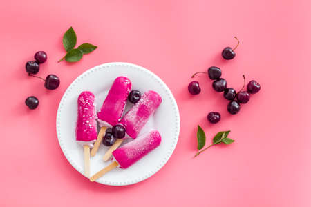 Cherry ice cream, berry on the table, top view