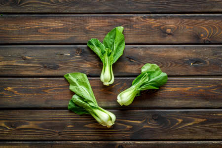 Bok choy on wooden table top viewの写真素材