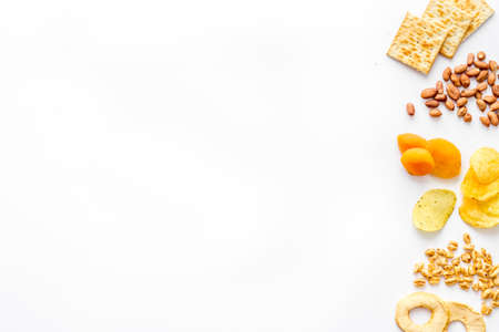 Mix of nuts and dried fruits top view with copy space