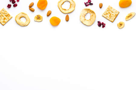Flat lay of appetizers and snacks overhead. Nuts and dried fruits with crackersの写真素材