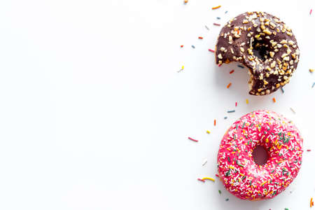 Donuts flat lay pattern on white background, top viewの写真素材