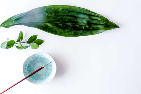 painted ceramic cup on white background top viewの写真素材