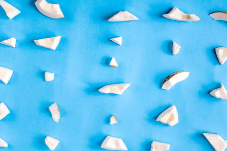 concept organic cosmetics with coconut on blue background top view
