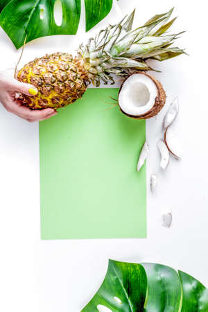 summer dessert with pineapples and coconut on white background top view mock upの写真素材