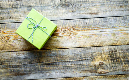 green gift box and on old wooden tableの写真素材