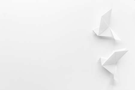 Origami pigeon. World Peace Day, care concept. Top view