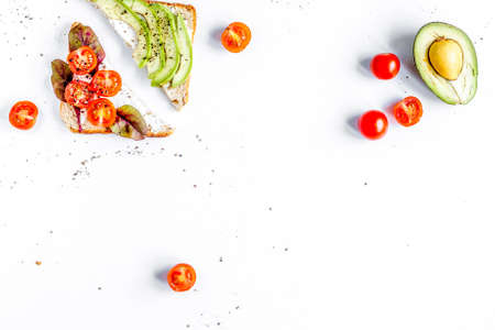 sandwiches set on white table background top view space for text
