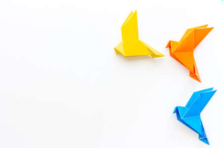 Origami concept. Paper birds top view, copy spaceの写真素材
