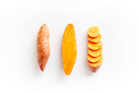 Set of whole and sliced sweet potatoes. Flat lay, top viewの写真素材