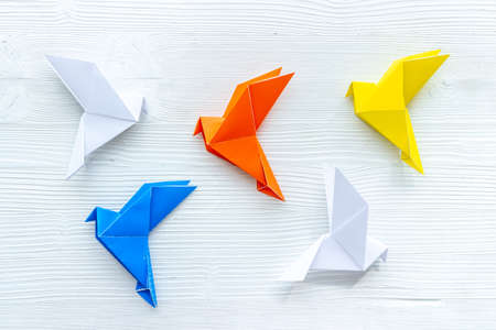 Paper birds of different shades. Origami concept. Top viewの写真素材