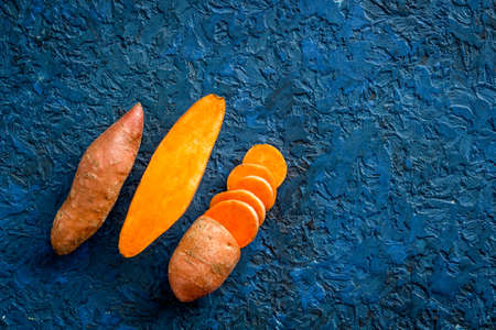Sliced sweet potato on kitchet table, top viewの写真素材