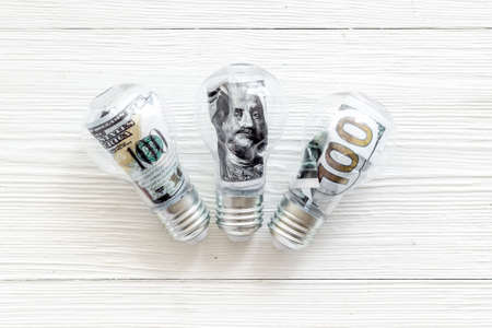 Money making idea concept with light bulb and dollar insideの写真素材