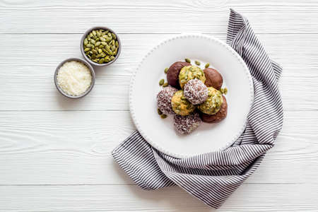 Homemade raw chocolate balls - vegan truffles with cacao and coconutの写真素材