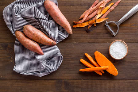 Sweet potato sliced - vegetable vegan food on the kinchen table