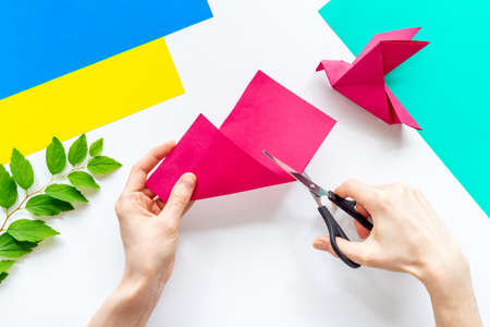 DIY concept. Doing origami paper bird, Top viewの写真素材