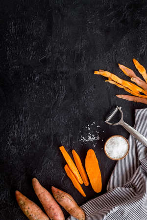 Sliced sweet potato on kitchet table, top viewの写真素材