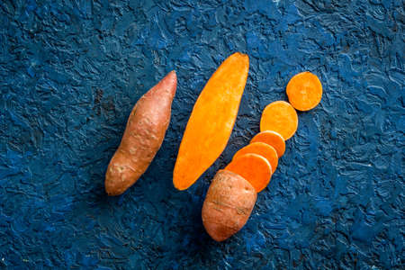 Flat lay of sweet potatoes - yams vegetables, top viewの写真素材