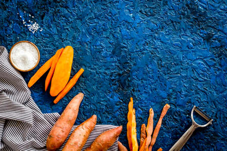 Sliced sweet potato on cutting board, top viewの写真素材