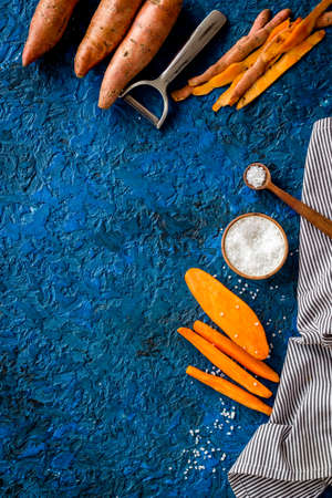 Layout of sweet potatoes. Organic vegetables background, overhead viewの写真素材