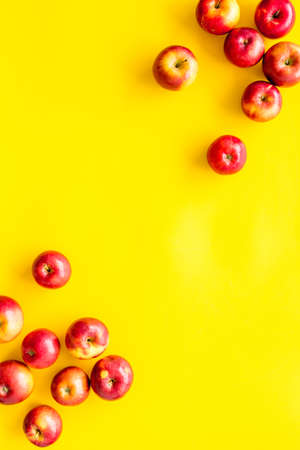 Frame of red apples on kitchen table top viewの写真素材